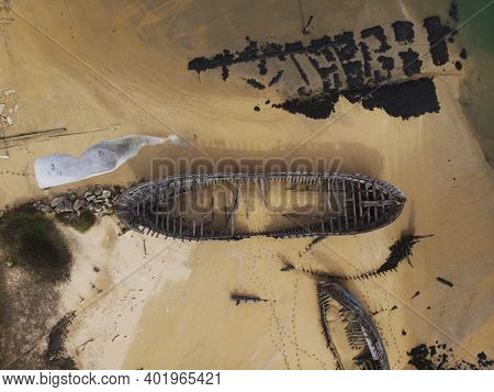 Aerial View Of Stranded Broken Wooden Shipwrecks Boat Graveyard Marine Cemetery In Magouer Etel Rive