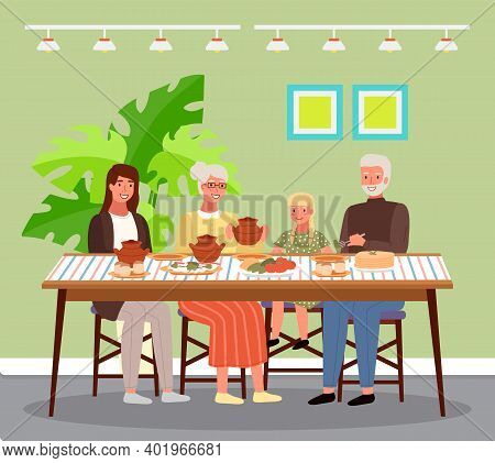 Family At Lunch In Russian Style. Relatives Are Communicating And Eating Traditional Food. Grandmoth