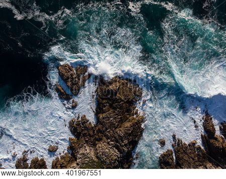 Aerial Panorama Of Waves Crashing On Rocky Coast Shore At Lighthouse Faro De Cabo Roncudo Costa Da M