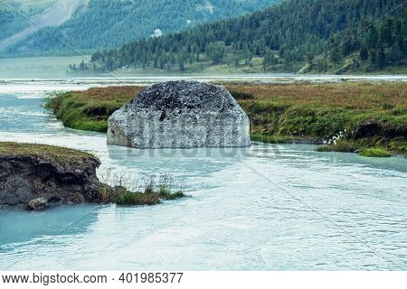 Scenic Alpine Landscape With Big Mossy Stone In Clear Azure Water Of Mountain River. Atmospheric Hig