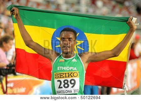 BARCELONA - JULY, 14: Muktar Edris of Ethiopia celebrates his victory on 5000 meters of the 20th World Junior Athletics Championships at the Olympic Stadium on July 14, 2012 in Barcelona, Spain
