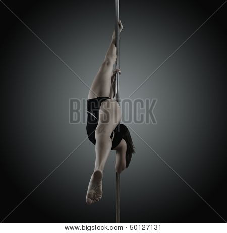 pole dancer, young woman dancing on pylon, toned and noise added