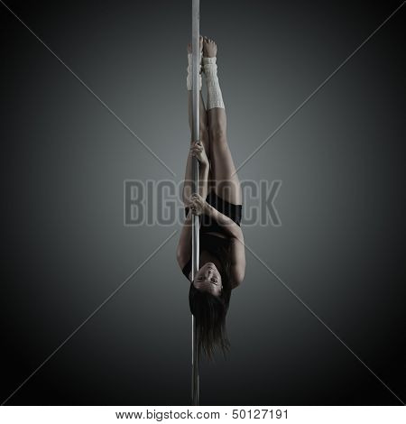 pole dancer, young woman dancing on pylon, toned and noise added