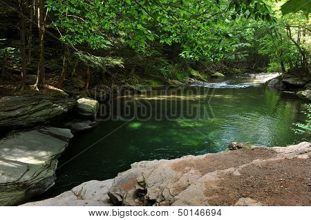 Mountain river with blue clean water and stones at Catskils mountains upstate NY