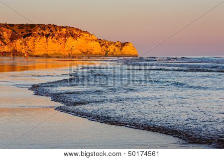 Sunset At Porto De Mos Beach In Lagos, Algarve, Portugal