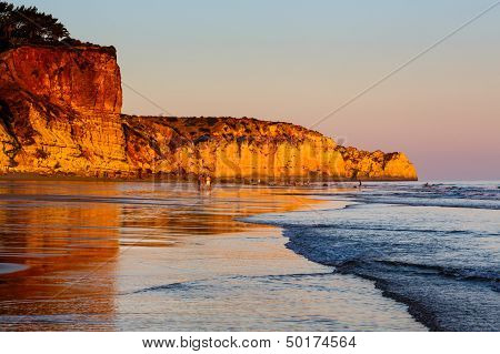 Sunset At Porto De Mos Beach In Lagos, Algarve, Portugal