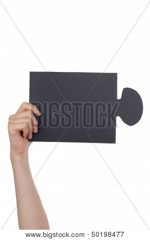 People Holding A Black Puzzle