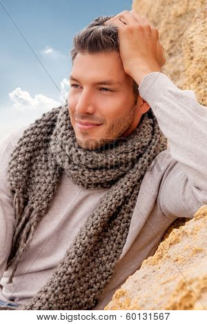 male relaxing on coast autumn or colder spring days