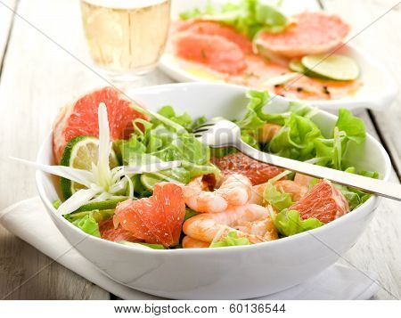 shrimp salad with slice grapefruit and lettuce