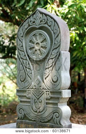 Stone boundary marker, symbolic of Buddhism