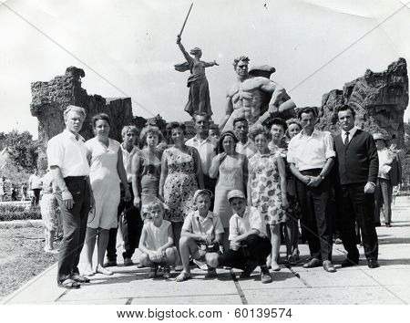 VOLGOGRAD, USSR - CIRCA 1970s: An antique photo shows group of tourists at the memorial complex 