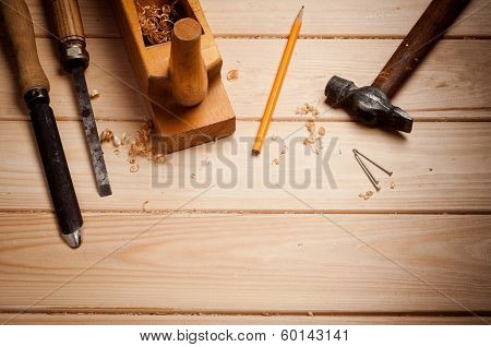 carpenter tools in pine wood table