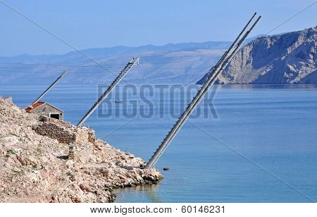 Rocky Beach In Lukovo Bay With Fishing Platforms, Croatia