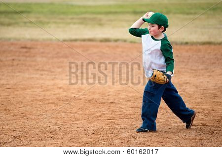 Boy throws baseball during practice
