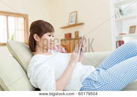Beautiful asian woman relaxing in the room 