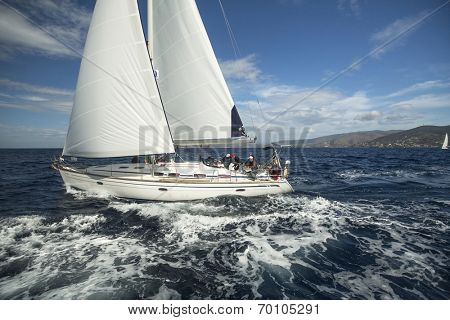 AEGEAN SEA, GREECE - APR 30, 2014: Unidentified sailboats participate in sailing regatta 