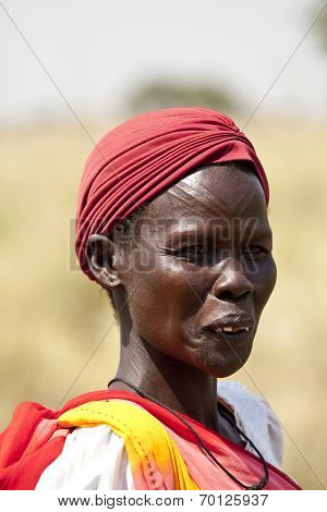 LILIIR, SOUTH SUDAN- DECEMBER 4 2010: Unidentified Dinka woman with tribal scarification in South Sudan