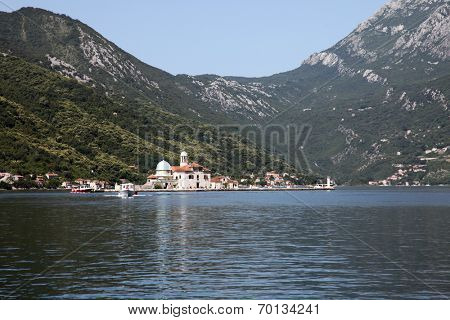 PERAST, MONTENEGRO - JUNE 08: Church of Our Lady of the Rocks. Our Lady of the Rocks is one of the two islets off the coast of Perast in Bay of Kotor, Montenegro, on Jun 08, 2012