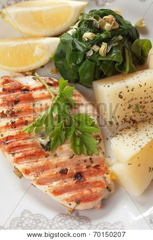 Grilled chicken breast with boiled potato and chard
