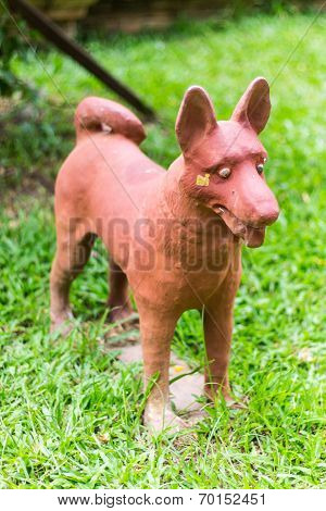 Thai Dog Statue On Grass