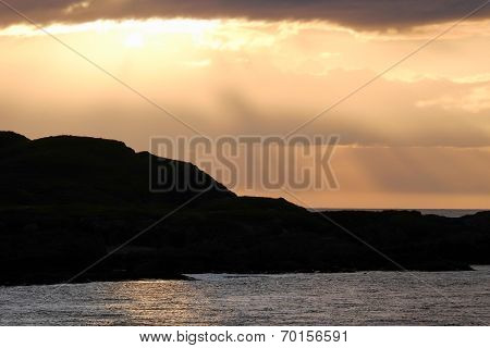 Sun breaking through clouds
