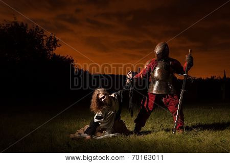 Medieval Knight Is Going To Make An Execution Of A Witch