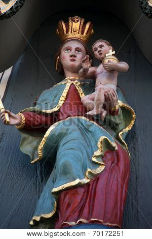 MILTENBERG, GERMANY - 20 JULY: Madonna with child Jesus, statue on the main street of Miltenberg in Lower Franconia, Bavaria, Germany, on July 20, 2013 
