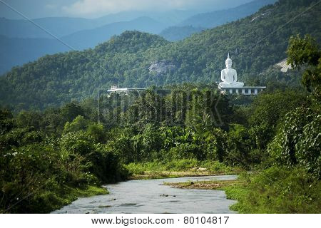 white buddha statue and river,Thailand