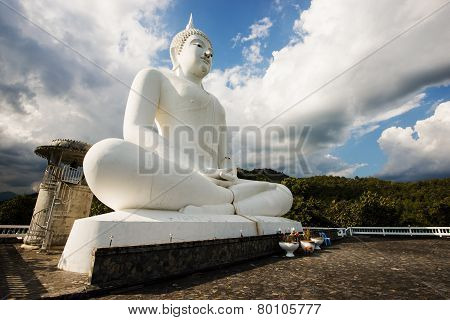 white buddha statue in the temple of Thailand