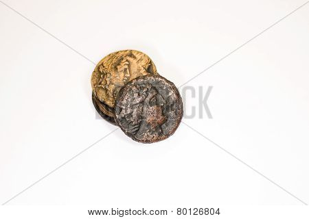 Four Old Bronze Coins On White Background