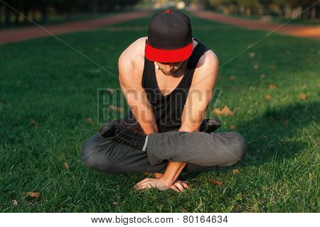 Man In A Red Cap Stands On Hands