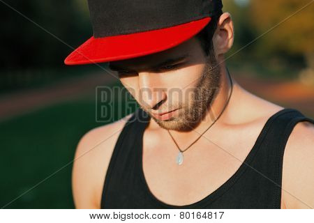 Dancer In A Red Cap In The Park.
