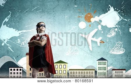 Girl of school age in super hero costume