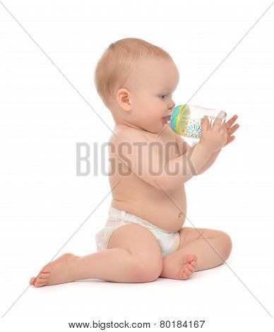 Infant Child Baby Toddler Sitting And Drinking Water From The Feeding Bottle