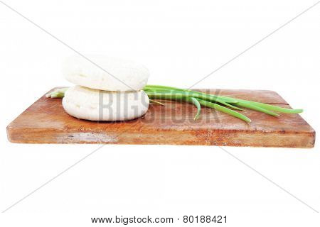dairy products : feta white cheese on cut board isolated over white background