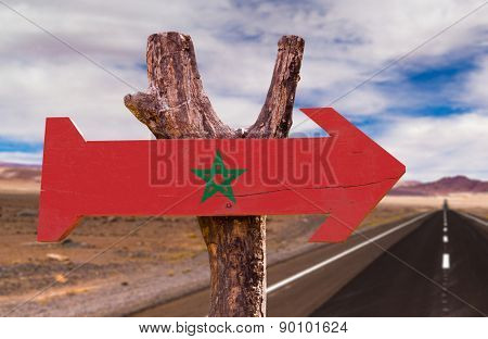Marocco Flag wooden sign with desert road background
