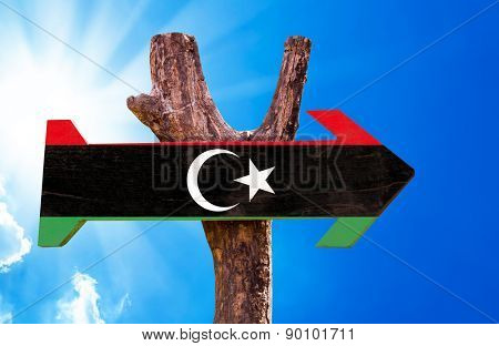 Libya Flag wooden sign with sky background
