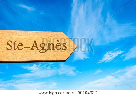 Wooden arrow sign pointing touristic destination