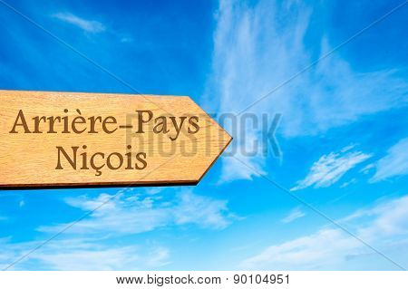 Wooden arrow sign pointing touristic destination