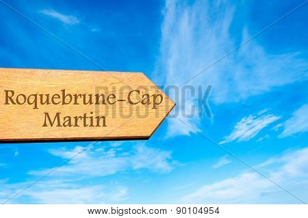 Wooden arrow sign pointing touristic destination