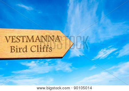 Wooden arrow sign pointing touristic destination