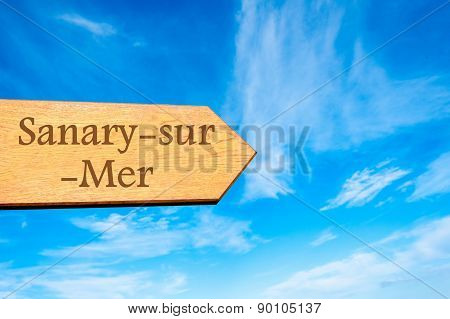 Wooden arrow sign pointing touristic destination