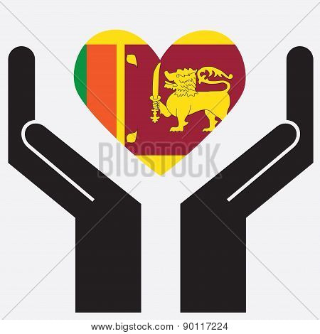 Hand showing Sri lanka flag in a heart shape.
