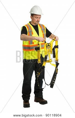 The man in a worker uniform and with building tools