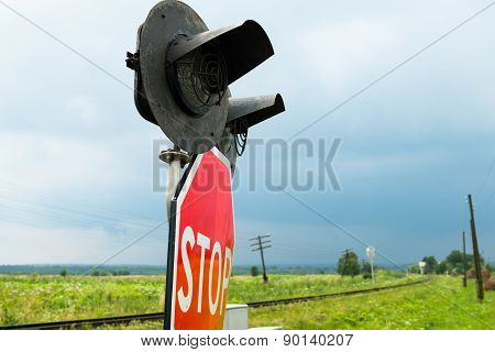 Traffic Lights And Signs At The Railroad Crossing