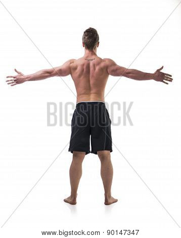 Back of young muscle man shirtless with arms spread open
