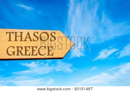 Wooden arrow sign pointing touristic destination