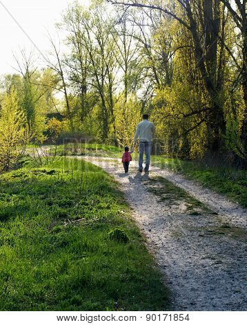 My dad. Father and daughter walk down the path.