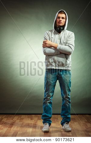 Hooded Man With Big Headphones On Neck