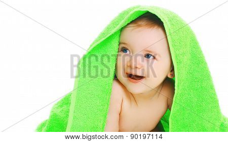 Closeup Protrait Of Cute Smiling Baby Under The Bright Green Towel On A White Background